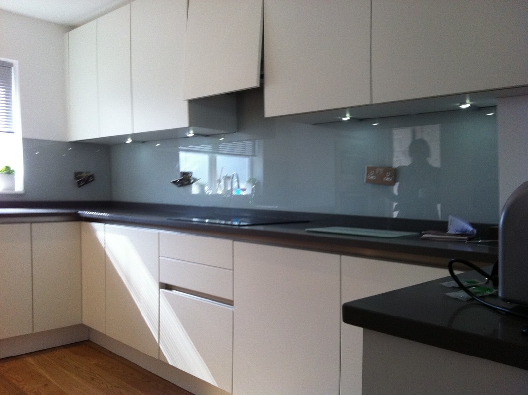 Grey glass kitchen splashback with LED lighting in Dalston