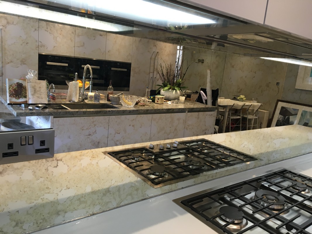 Mirror glass splashback in Dalston luxury kitchen